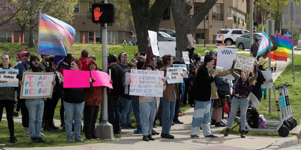 Transgender friends, family and communities gathered Sunday, April 16 at Mill Creek Park on the plaza to protest Attorney General Andrew Bailey’s new executive action so strict that it will essentially ban gender-affirming care for many adults and minors in Missouri.