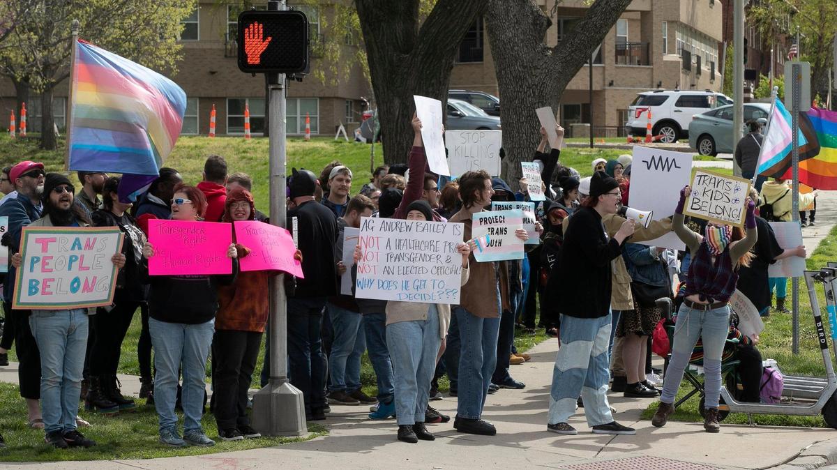 Transgender friends and family gathered Sunday, April 16 at Mill Creek Park on the plaza to protest Missouri Attorney General Andrew Bailey’s restrictions on gender-affirming care. Bailey later withdrew the rule.