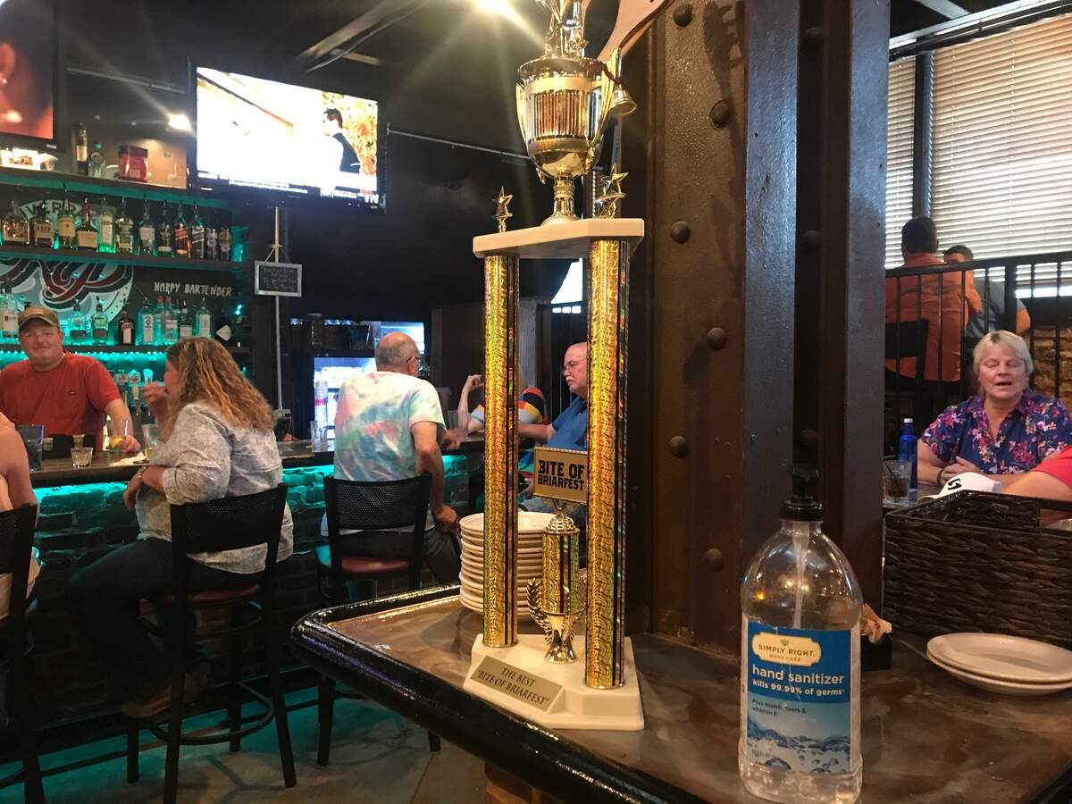 At Riverpark in Platte County, a large bottle of sanitizer sat at the center of the dining room.