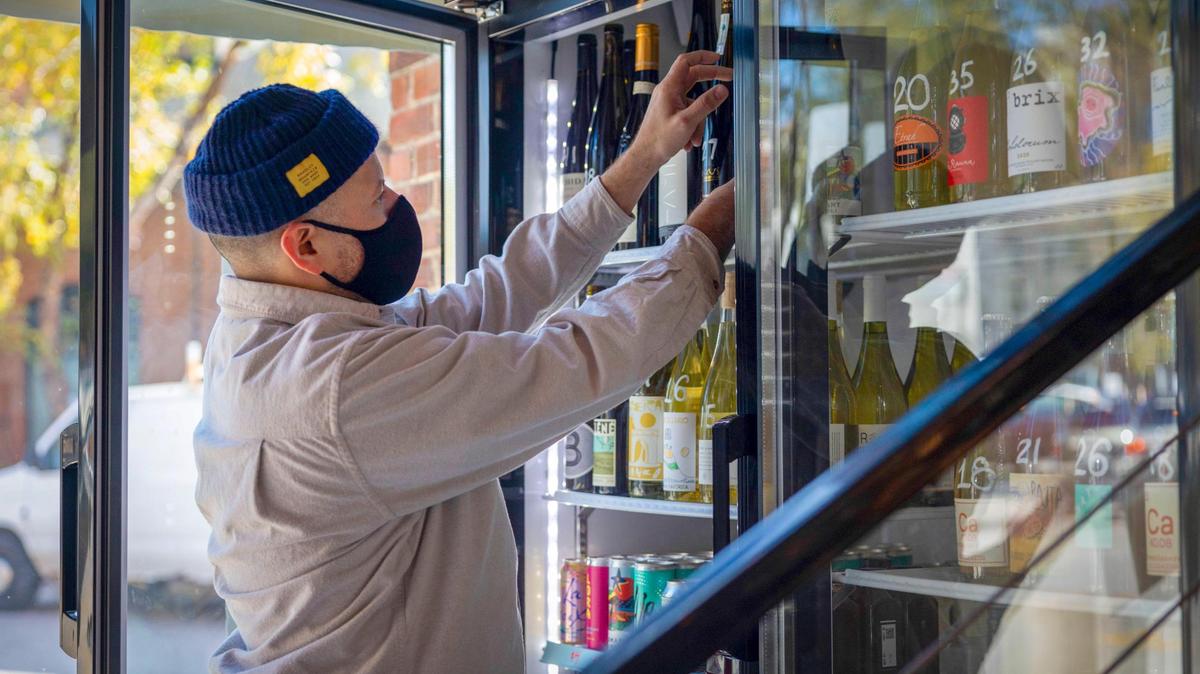 Richard Garcia, with Big Mood Natural Wines in Kansas City, is making his business mask optional to encourage more people to shop in his store at 2020 Baltimore Ave., Suite 102, and to help the local economy.  Garcia, who has an unvaccinated 9-year-old daughter at home, said he plans to continue to wear a mask to protect her. 