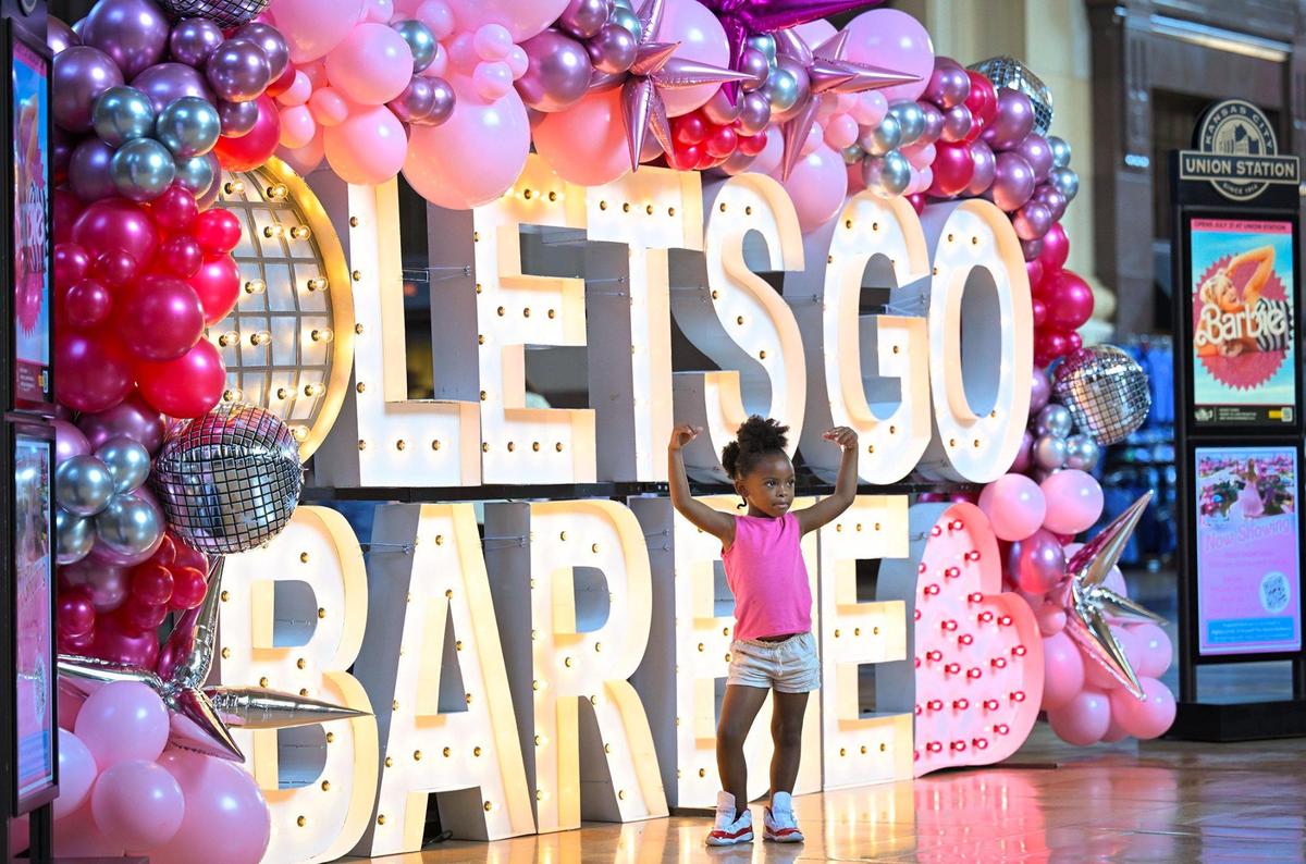 Barbie fans including Amira Sanders, 4, of Kansas City, flocked to Union Station for Barbie-themed photos on Thursday, July 20, 2023, in Kansas City. Amira, who was visiting the display with her mother, Mariea Poole, displayed her girl power for the photo.
