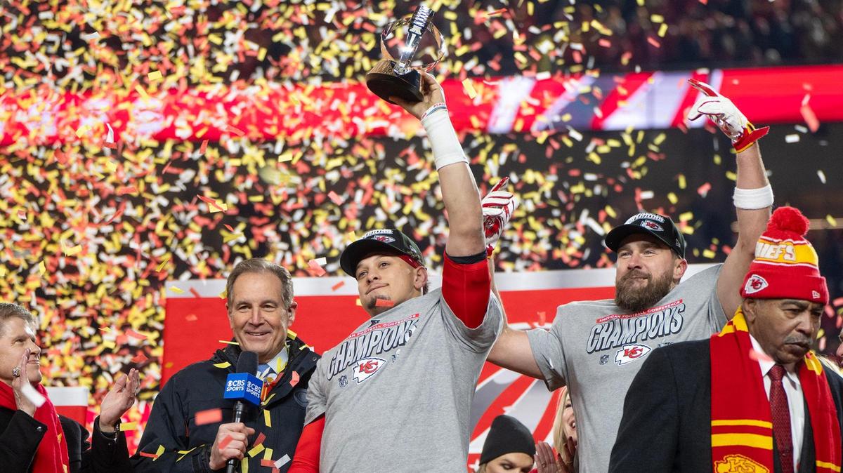 Chiefs owner Clark Hunt looks on a Kansas City Chiefs quarterback Patrick Mahomes (15) hoists the Lamar Hunt Trophy and tight end Travis Kelce celebrate after the teams’ 32-29 win over the Buffalo Bills to claim the AFC Championship on Sunday, Jan. 26, 2025, at GEHA Field at Arrowhead Stadium.