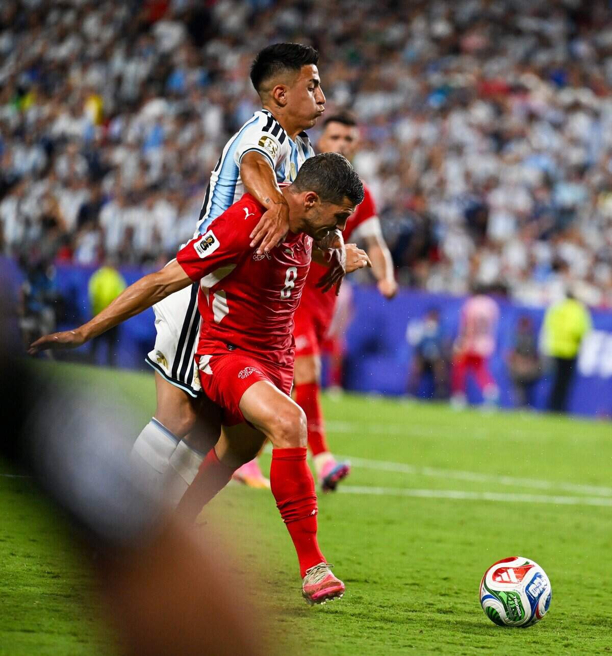 Players get tangled up during extra time of the Argentina vs. Switzerland 2026 World Cup Quarterfinal football match at Kansas City (Arrowhead) Stadium in Kansas City on Saturday, July 11, 2026.