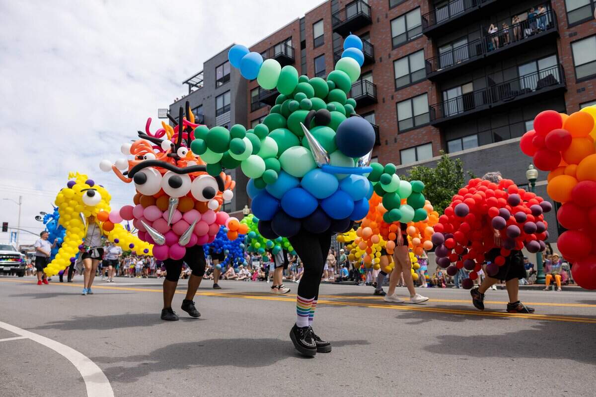 Balloon monsters created by Pop Culture Sculptures walk in Kansas City's Annual Pride Parade at Westport Rd on Saturday, June 6, 2026.