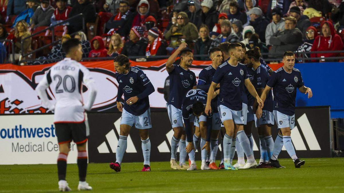 Sporting Kansas City forward Daniel Salloi celebrates with teammates after scoring the team’s first goal of the 2023 MLS season at FC Dallas Saturday night.