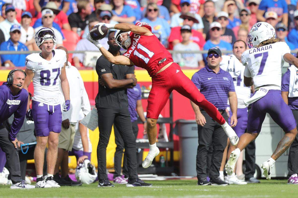 Kansas Jayhawks wide receiver Luke Grimm appears to make an acrobatic catch, but the pass was ruled incomplete during Saturday’s game against the TCU Horned Frogs at GEHA Field at Arrowhead Stadium.