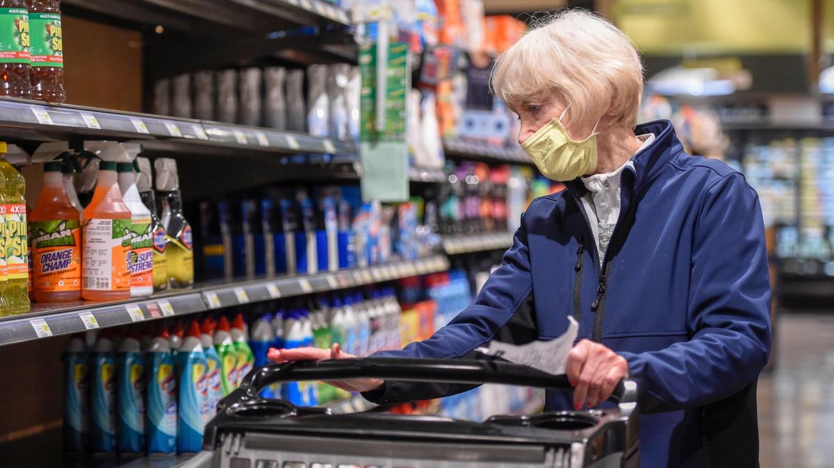 Taking advantage of shopping time for seniors, Virginia Wolfe, 83, of Prairie Village searched for cleaners and hand sanitizers at the start of the pandemic in March 2020.