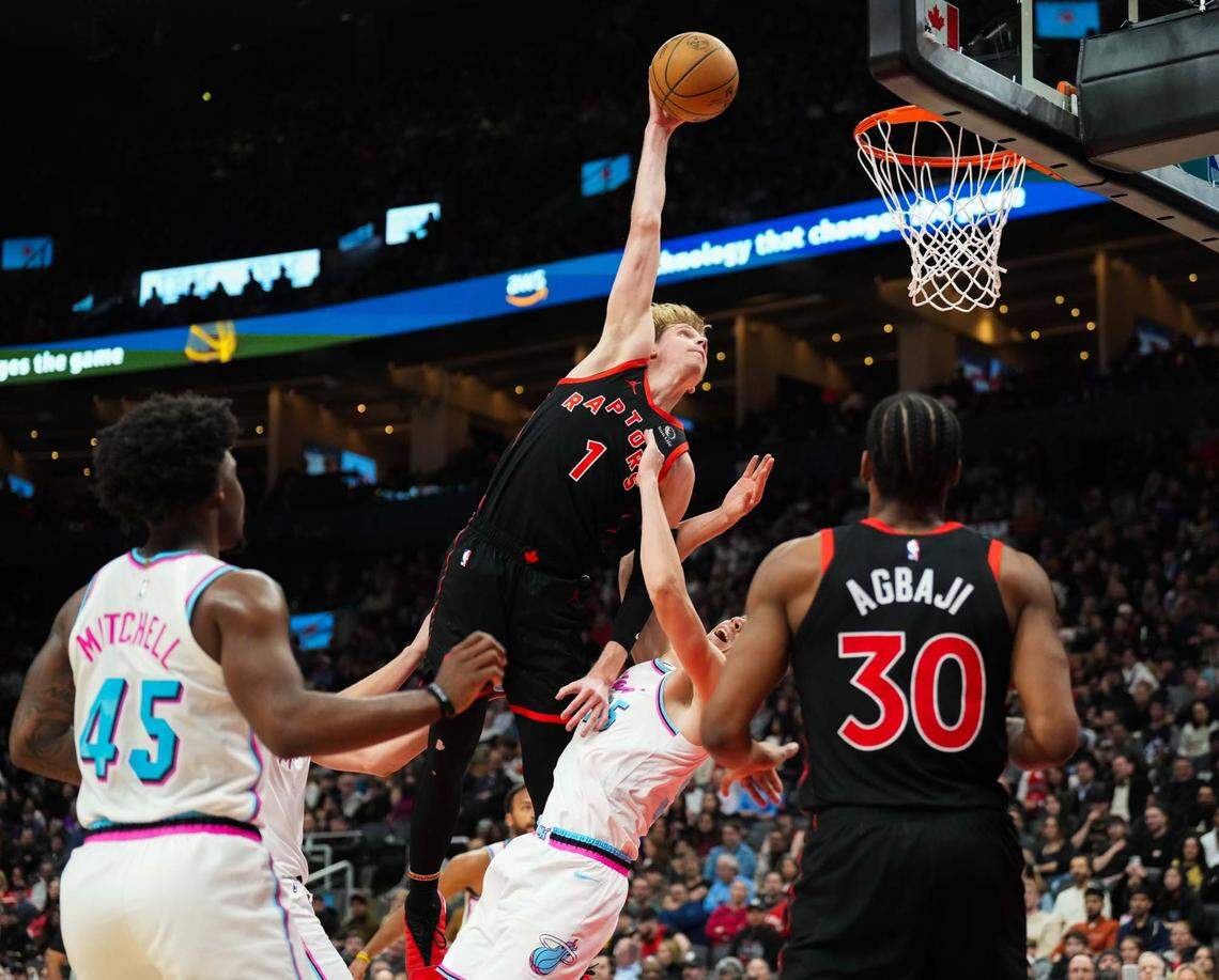 Toronto Raptors guard Gradey Dick (1) drives to the net against Miami Heat forward Duncan Robinson (55) at Scotiabank Arena on Feb. 21, 2025.