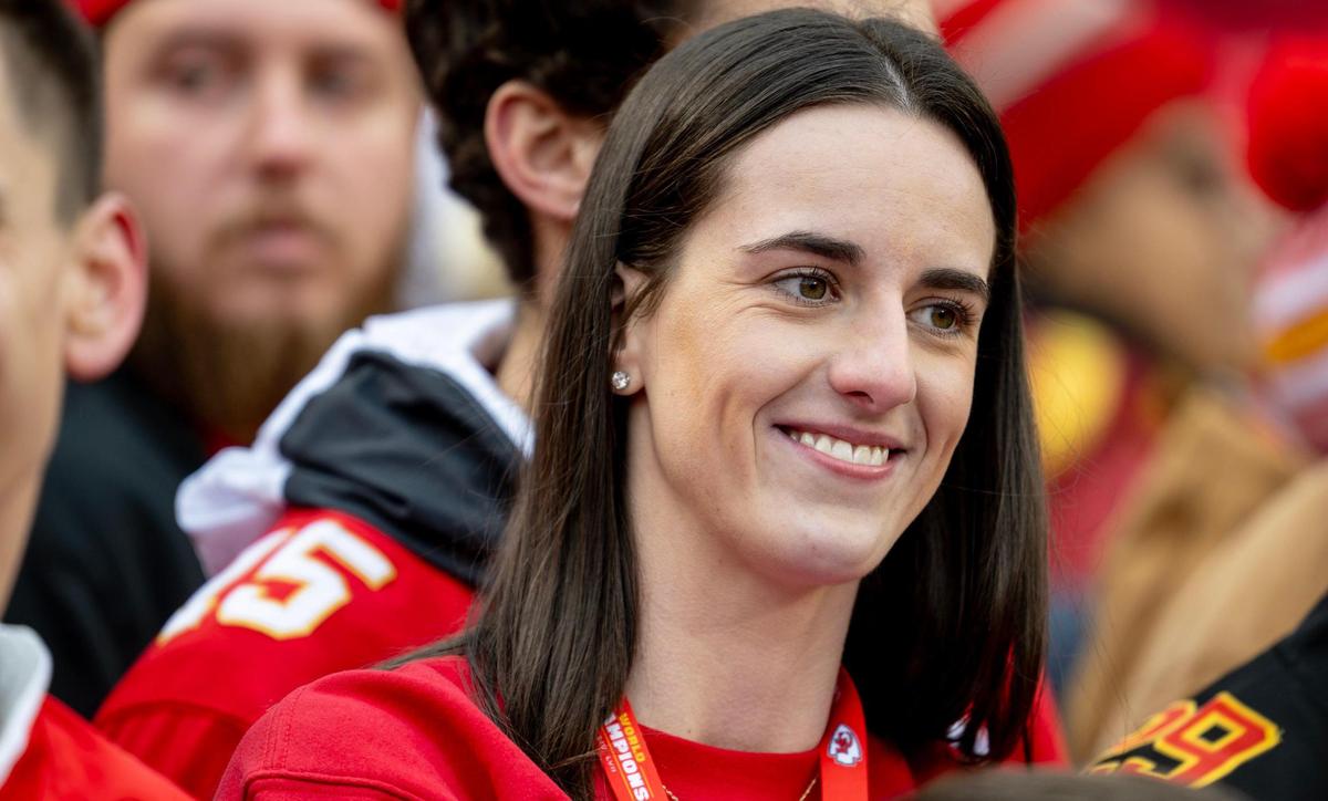 Iowa basketball star Caitlin Clark stood on the sidelines as the Kansas City Chiefs warmed up before their Christmas Day game against the Las Vegas Raiders in December.