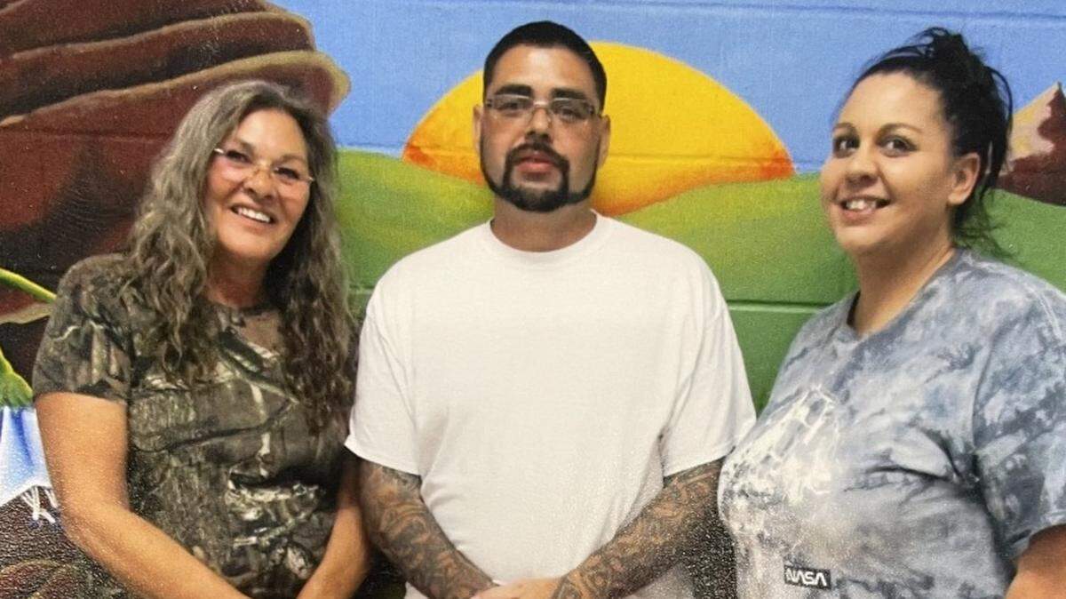 Daniel Wallace with his mother Robin Wallace, left, and a friend in 2022. His mom was killed in a car crash in May 2023.