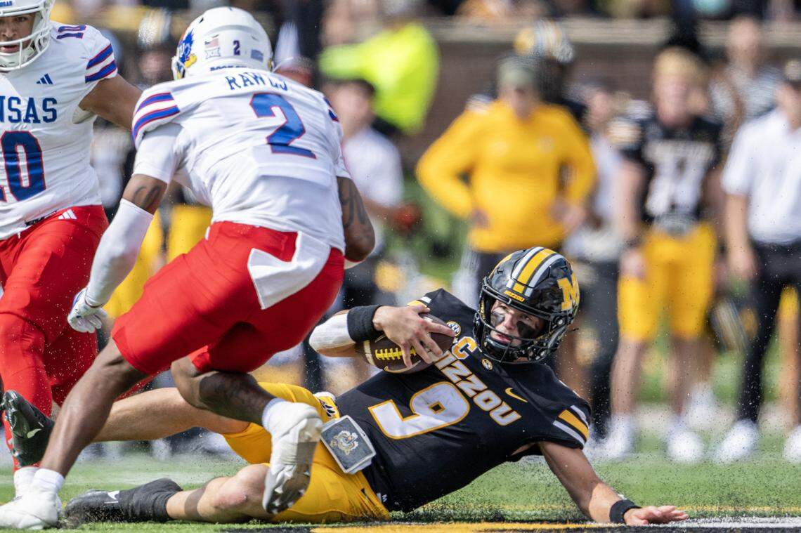 Missouri Tigers quarterback Beau Pribula (9) slides in the second quarter during a game against the Kansas Jayhawks at Faurot Field at Memorial Stadium on Saturday, Sept. 6, 2025, in Columbia.