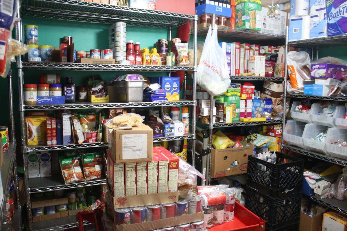 One bedroom in Jennifer and Adam Parker’s home is filled with food that will restock the pantry.