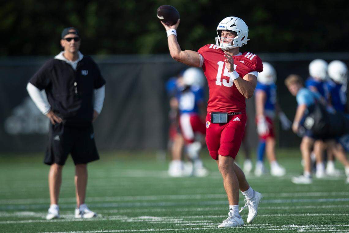 Kansas quarterback Cole Ballard (15) throws a pass during an outdoor practice on July 30, 2025.