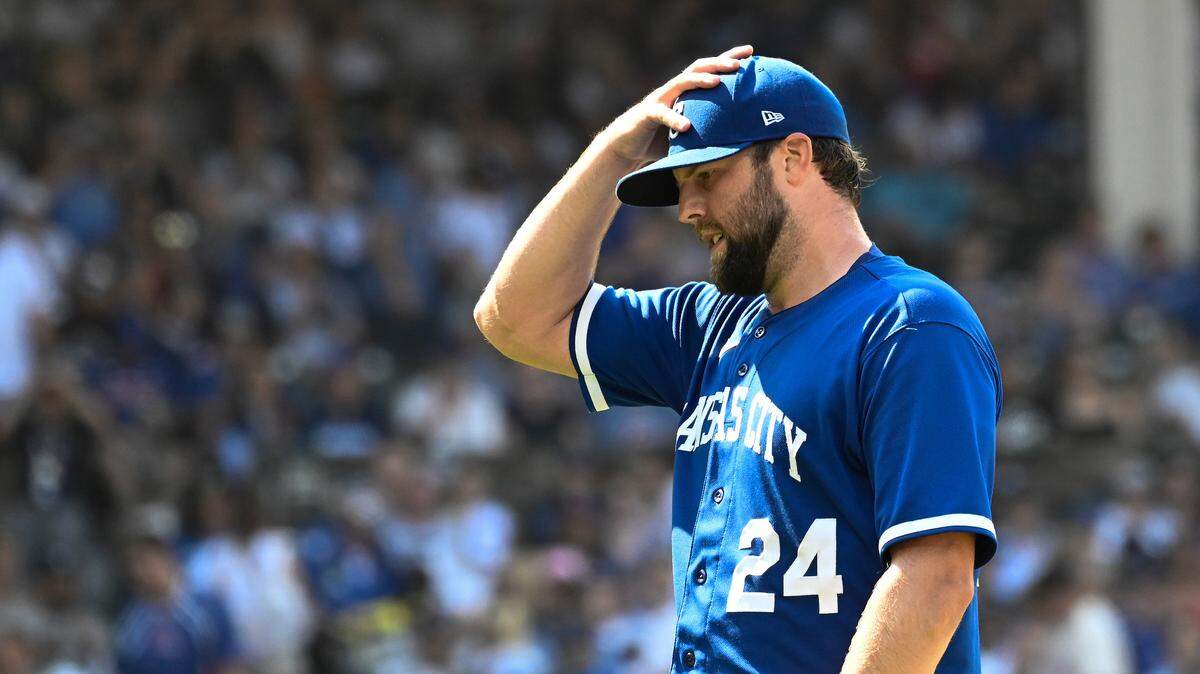 Kansas City Royals starting pitcher Jordan Lyles holds his hat after surrendering an eighth-inning homer to Chicago Cubs catcher Miguel Amaya on Sunday at Wrigley Field.