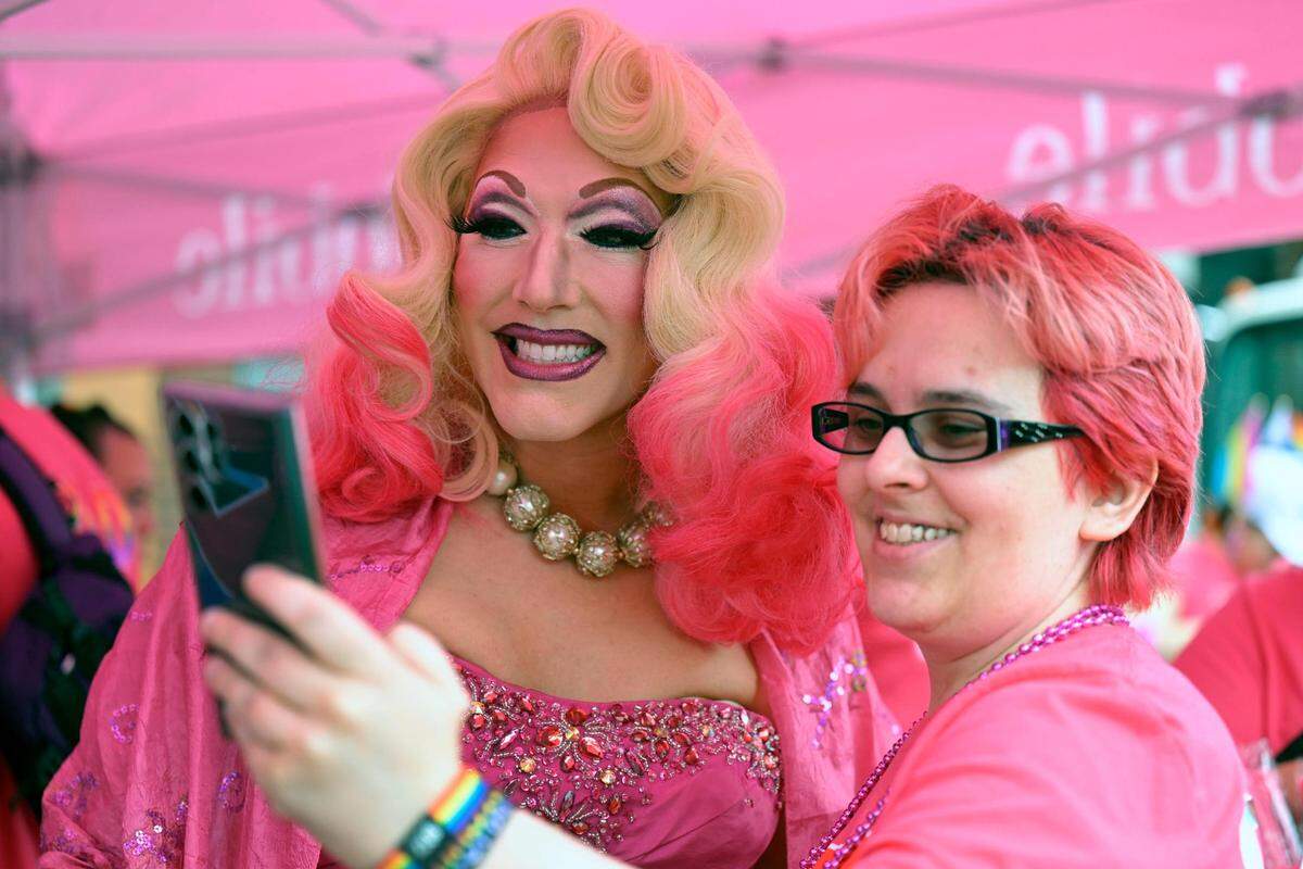 Performer Daisy Bucket, left, took a selfie with Rhiannon Dewitt of Kansas City at the KC Pride Parade on Saturday.