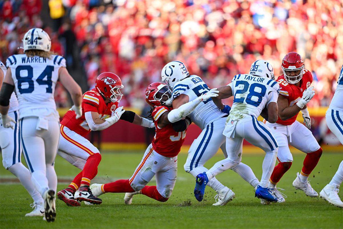 Kansas City Chiefs linebacker Nick Bolton (32) tackles Indianapolis Colts guard Quenton Nelson (56) on Sunday, Nov. 23, 2025, at GEHA Field at Arrowhead Stadium in Kansas City.