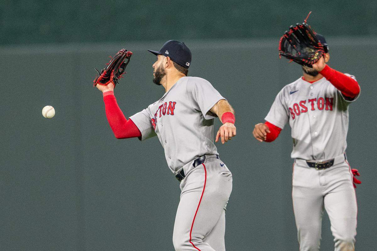 Boston Red Sox fielders can’t make the catch during a game against the Kansas City Royals at Kauffman Stadium on Wednesday, May 20, 2026.