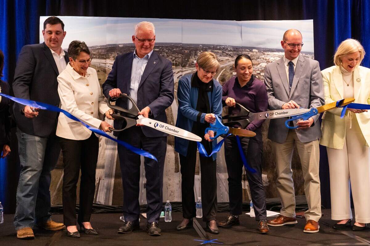 Kansas Governor Laura Kelly and Kansas State Rep. Sharice Davids help cut the ribbon at a ceremony for the opening of new US-69 Highway Express Lane, on Tuesday, Feb. 17, in Overland Park.