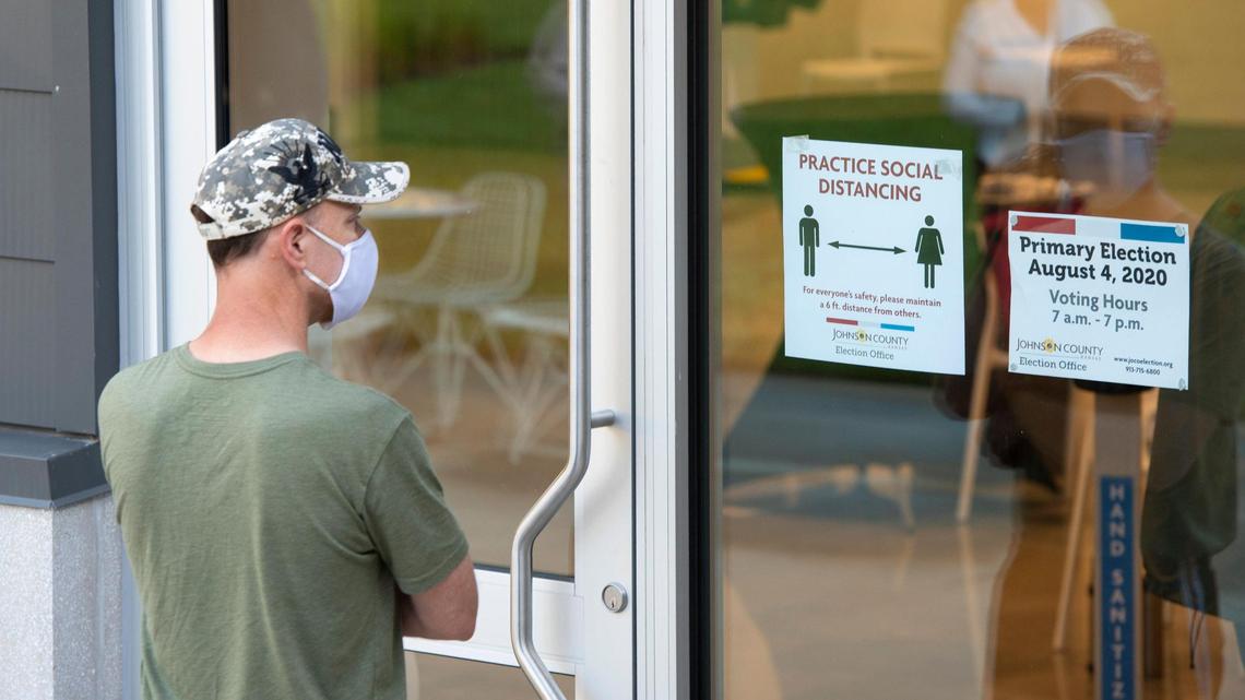 A voter waited in line outside to cast his vote in the primary election Tuesday at the Johnson County Arts and Heritage Center in Overland Park.