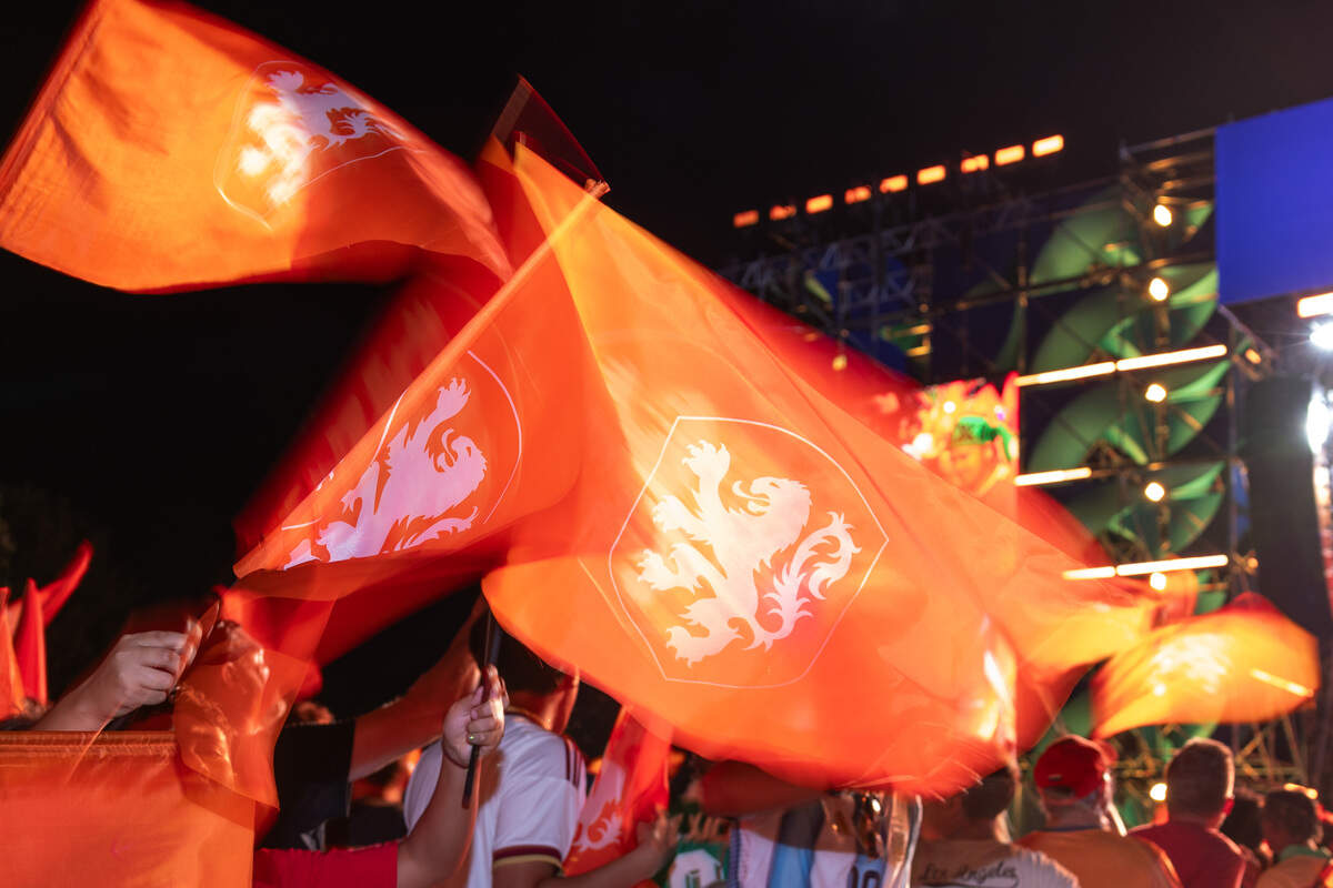 Dutch fans wave their flags and cheer as they celebrate their team during the Bij Oranje Party at Fan Fest on Wednesday, June 24, 2026.
