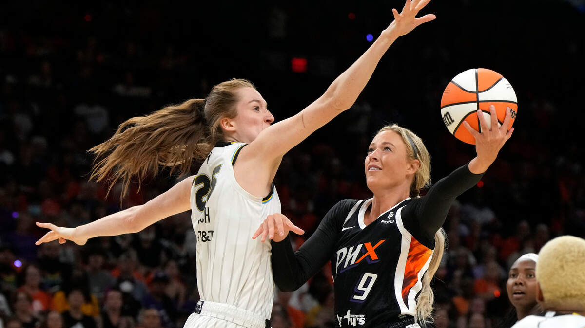 Phoenix Mercury guard Sophie Cunningham, right, shoots over Chicago Sky guard Morgan Bertsch during a WNBA game last week.