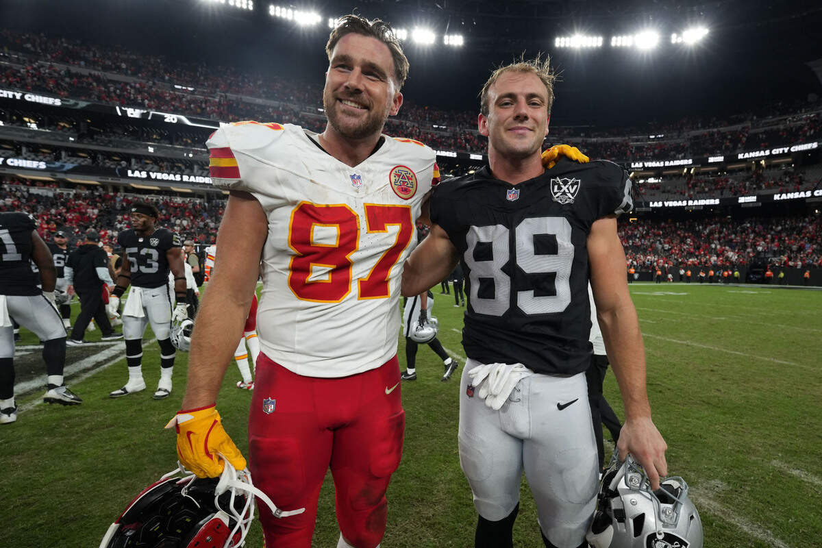 Kansas City Chiefs tight end Travis Kelce (87) and Las Vegas Raiders tight end Brock Bowers (89) pose after the game at Allegiant Stadium.
