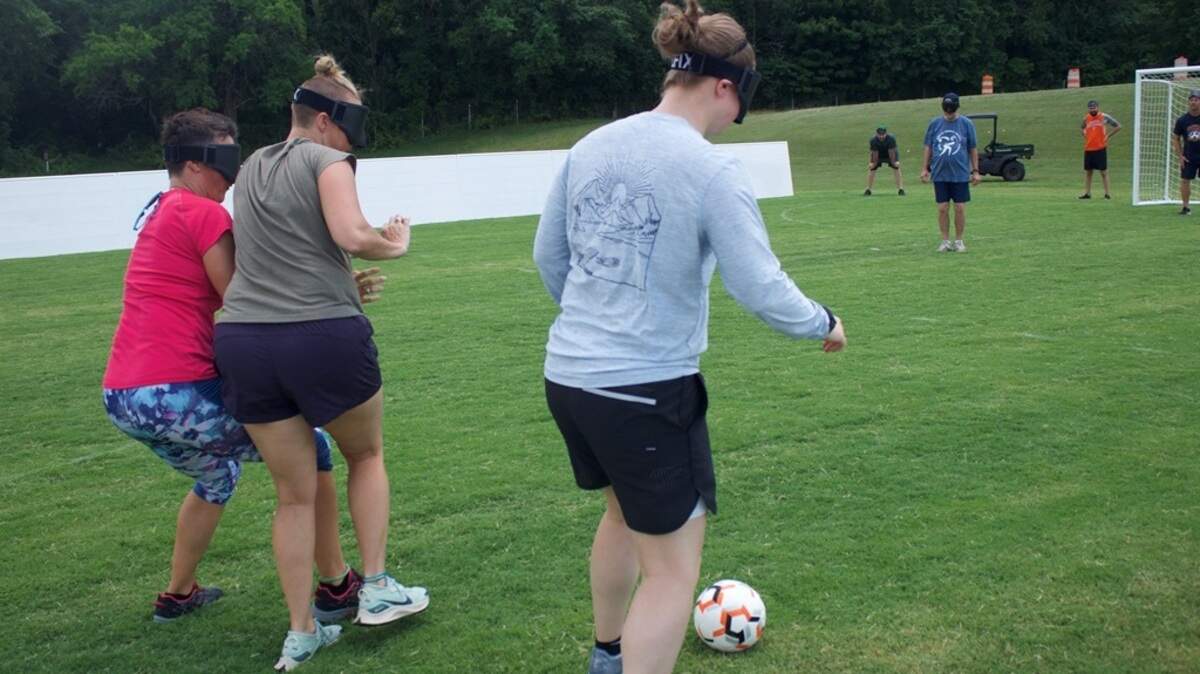 Kansas State School for the Blind teacher Nicole Drake (middle) plays blind soccer at the June 22-23 USA Blind Soccer Coaching Education Summit in Virginia.