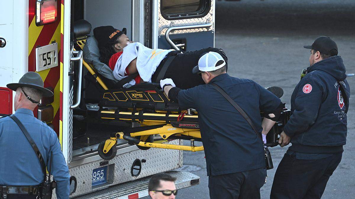 Medical personnel load a woman into an ambulance after a shooting at Union Station after the Kansas City Chiefs Super Bowl LVIII victory parade on Wednesday, Feb. 14, 2024, in Kansas City, Missouri. 