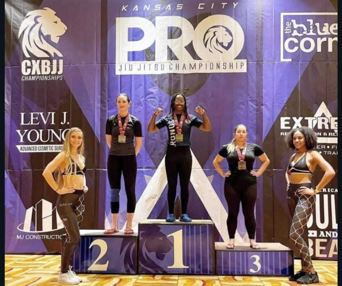 Ray’Von Haney stands at first place on a podium at a professional Jiu-jitsu competition in Kansas City.