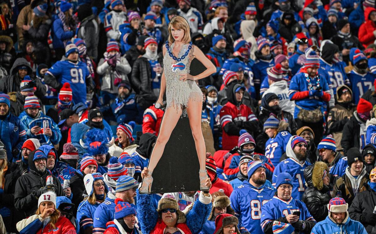A Buffalo Bills fan holds up a cutout of pop star Taylor Swift in the stands before the Bills played the Kansas City Chiefs in the AFC Divisional playoff game Sunday in Orchard Park, New York.