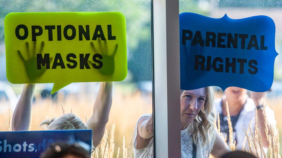 Parents protested mask mandates outside a Shawnee Mission school board meeting last year.