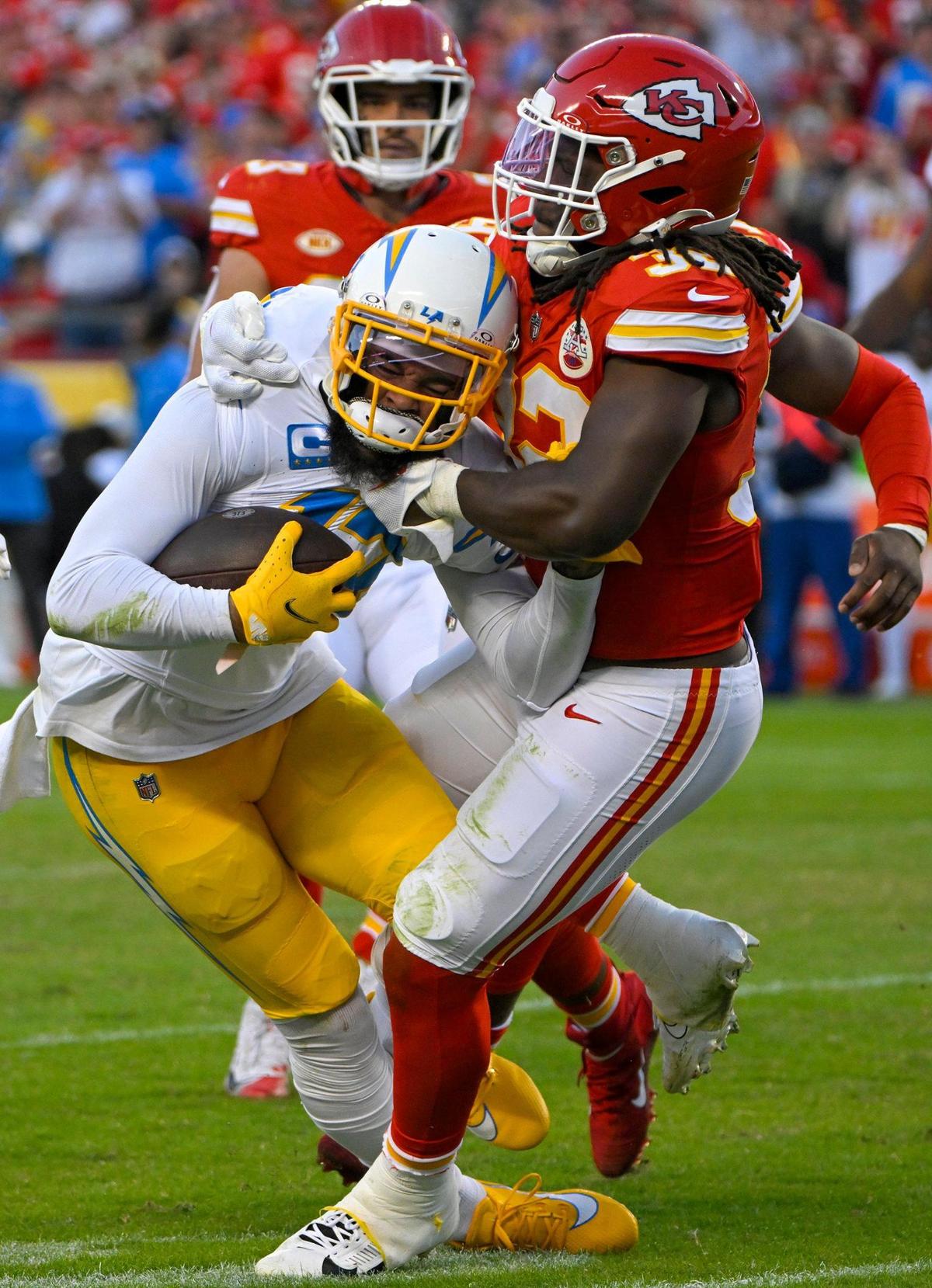 Chiefs linebacker Nick Bolton tackles Los Angeles Chargers wide receiver Keenan Allen during Sunday’s game at GEHA Field at Arrowhead Stadium.