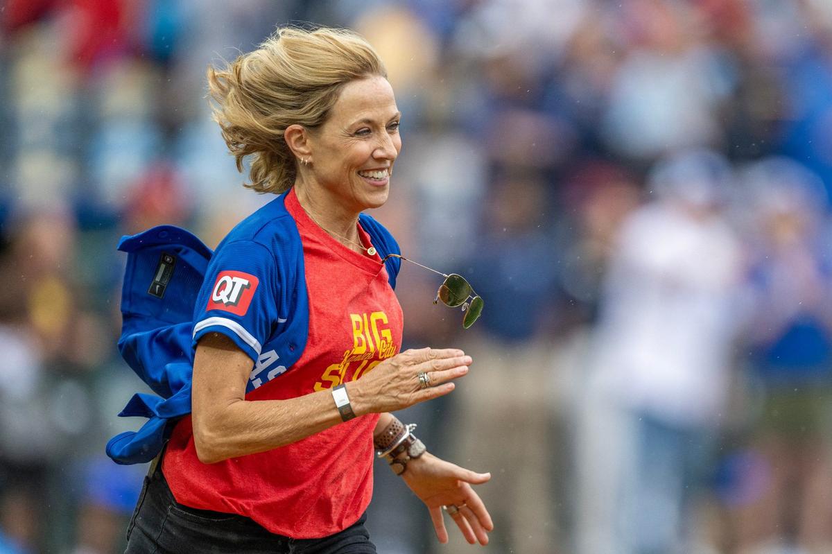 Singer Sheryl Crow runs to first base during the Big Slick celebrity softball game at Kauffman Stadium on Friday, May 31, 2024, in Kansas City.