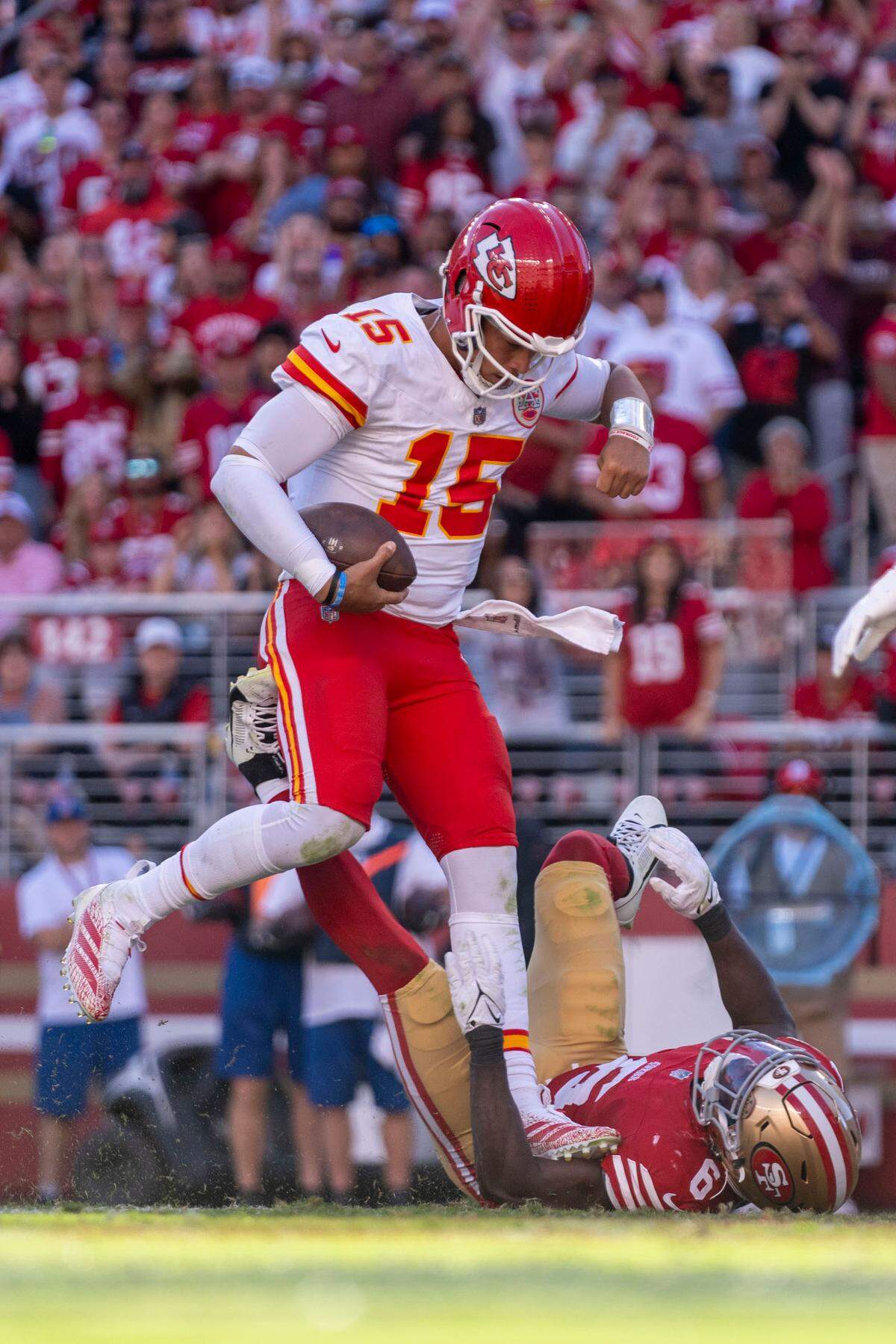 Kansas City Chiefs quarterback Patrick Mahomes (15) scores a touchdown against San Francisco 49ers safety Malik Mustapha (6) during the fourth quarter at Levi’s Stadium.