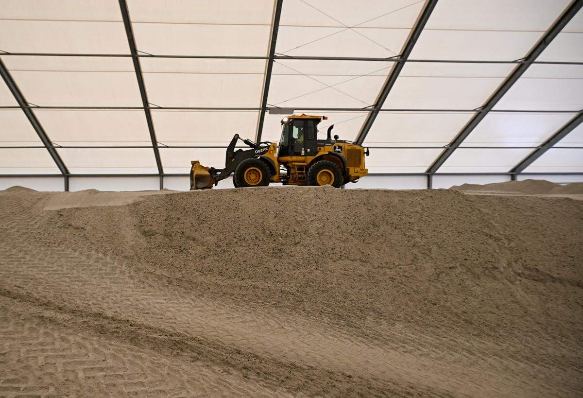 A huge pile of a salt brine mixture used to treat to roads is seen on Friday, Jan. 23, 2025 in Kansas City. Michael Shaw, KC's Public Works Director, said the city began treating the roads a few days ago in preparation. 