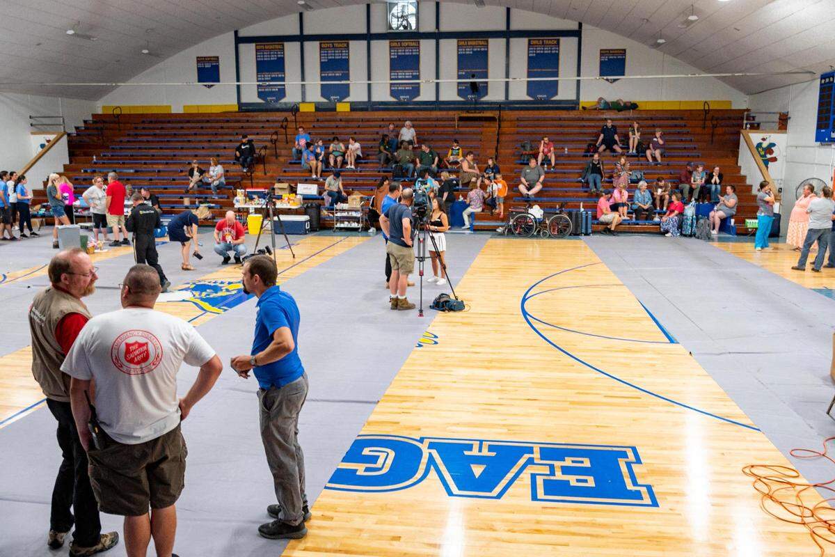 Passengers of an Amtrak train that crashed into a truck near Mendon, Missouri, Monday gather in the gymnasium at Northwestern R-1 School.