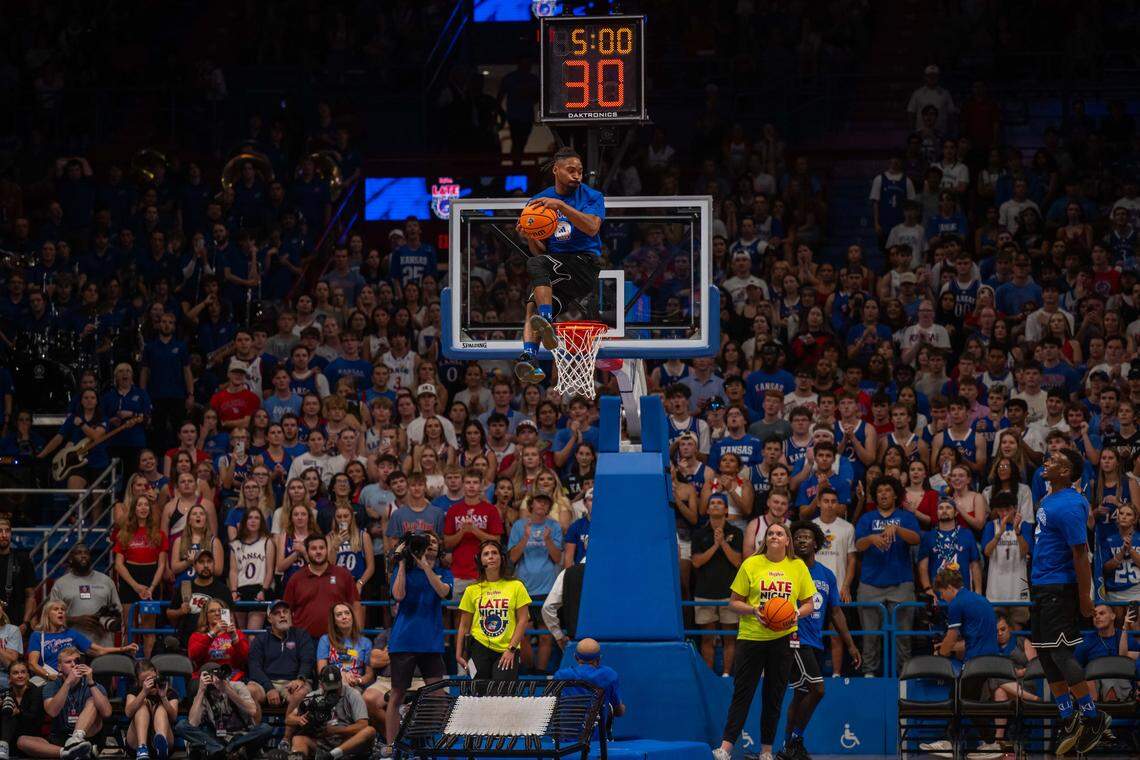 Acrobats perform high flying dunks as part of the festivities at Late Night in the Phog, on Friday, October 17, 2025, in Lawrence.