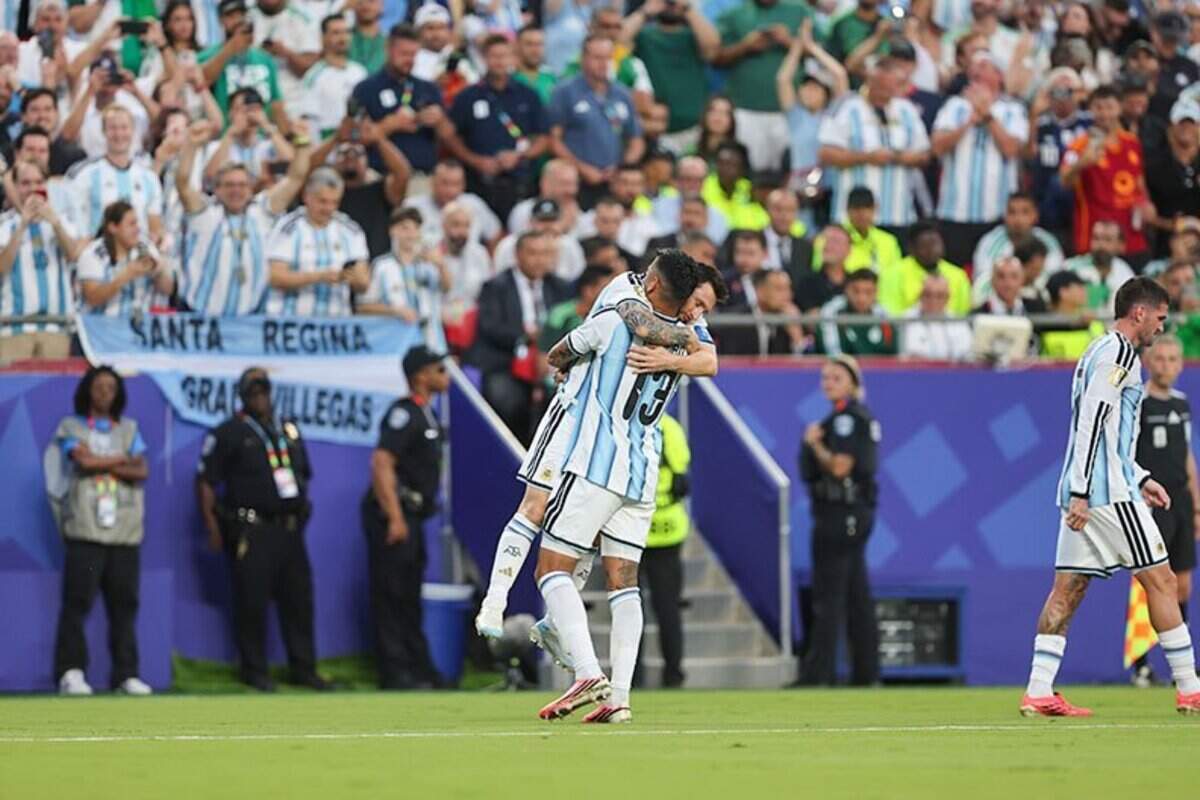 Argentina forward Lionel Messi (10) celebrates with Argentina defender Cristian Romero (13) after Messi scored the first goal of the Argentina vs. Algeria FIFA World Cup group-stage soccer match at Kansas City (Arrowhead) Stadium in Kansas City on Tuesday, June 16, 2026.