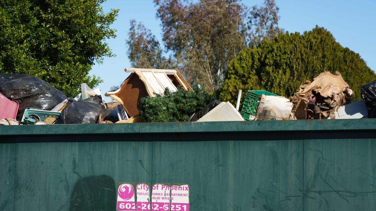 Is it legal in Kentucky to look for discarded items in commercial dumpsters, like the one seen in this file photo?