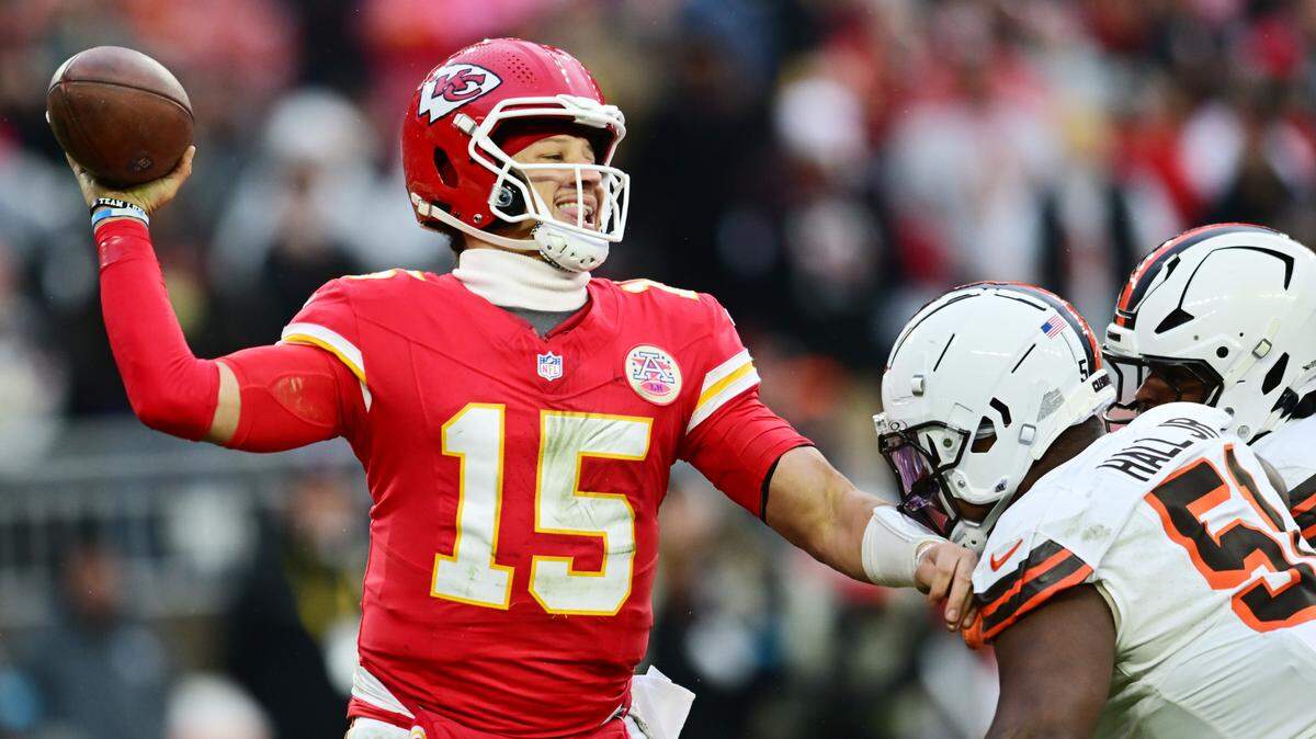 Kansas City Chiefs quarterback Patrick Mahomes gets off a pass in the face of a stiff pass rush from Cleveland Browns defensive tackle Mike Hall Jr. and linebacker Devin Bush during an NFL Week 15 game at Huntington Bank Field in Cleveland, Ohio on Sunday, Dec. 15, 2024.