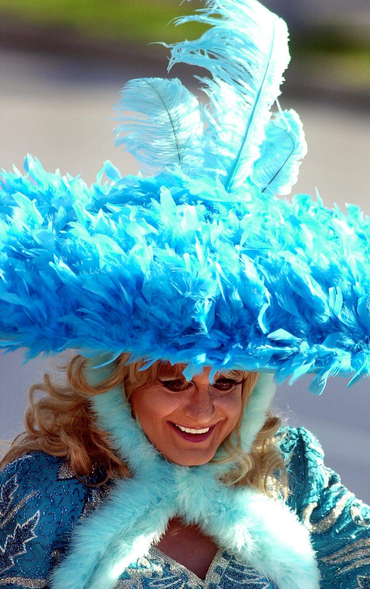 A local performer known as Belle Starr waved to those viewing the parade along Broadway in Westport in 2003.