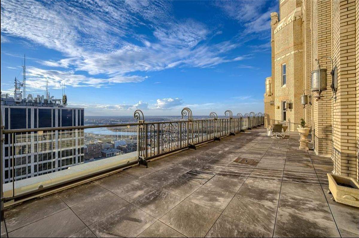 The 909 Walnut St. condo has a balcony that wraps around the entire building.