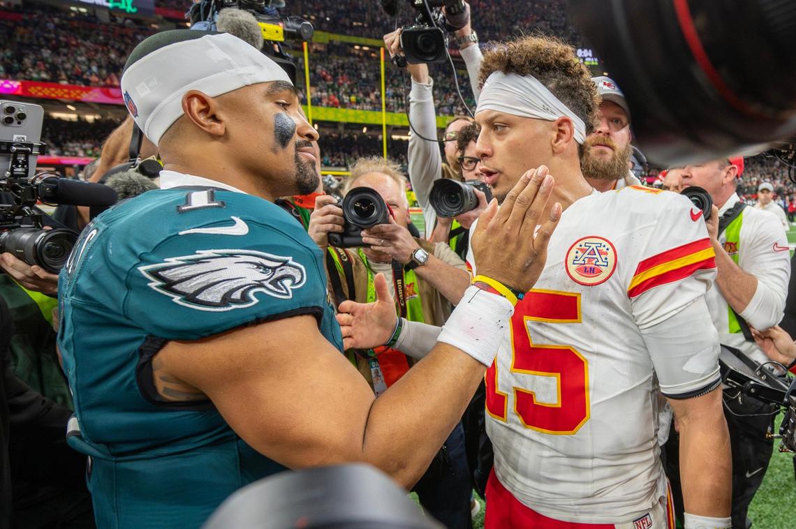 Philadelphia Eagles quarterback Jalen Hurts (1) and Kansas City Chiefs quarterback Patrick Mahomes (15) meet on the field after the Eagles’ 40-22 victory over the Chiefs in Super Bowl LIX on Sunday, Feb. 9, 2025, in New Orleans.