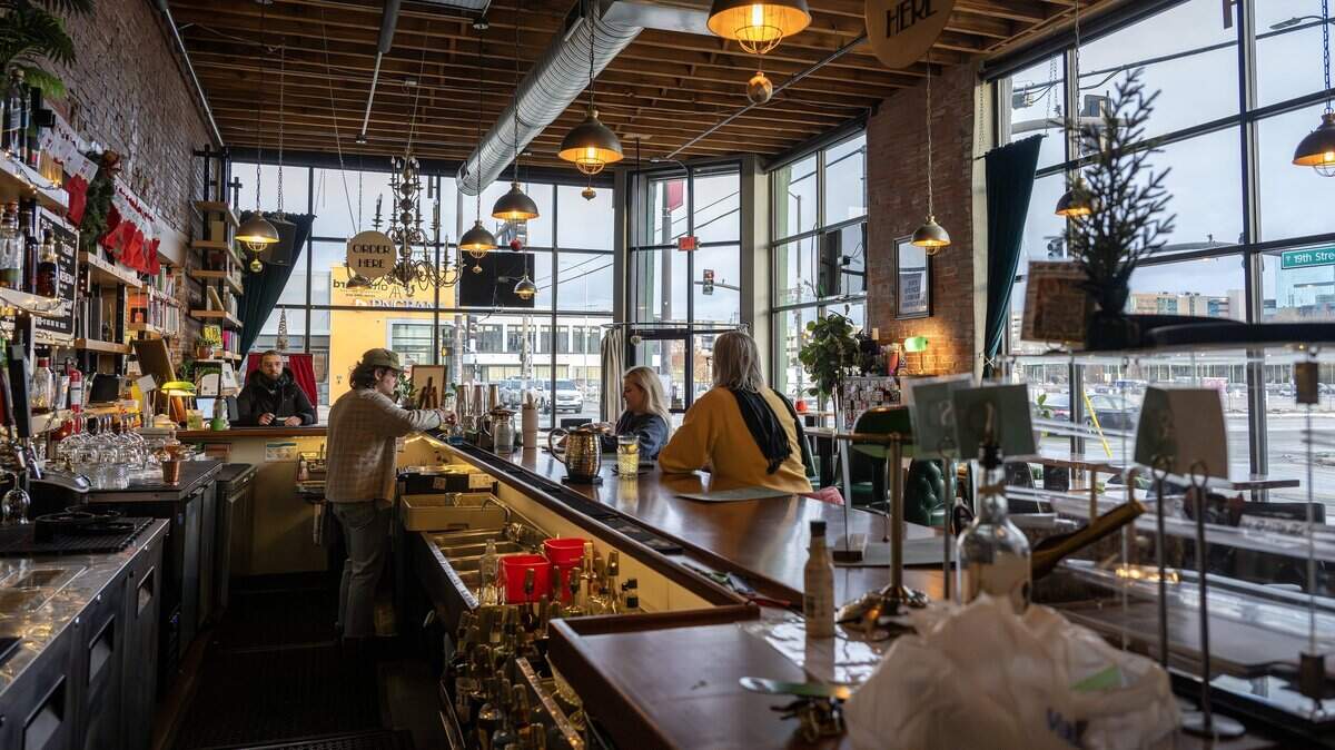 Guests sit at the bar inside Afterword on Wednesday, Dec. 3, 2025, in Kansas City.