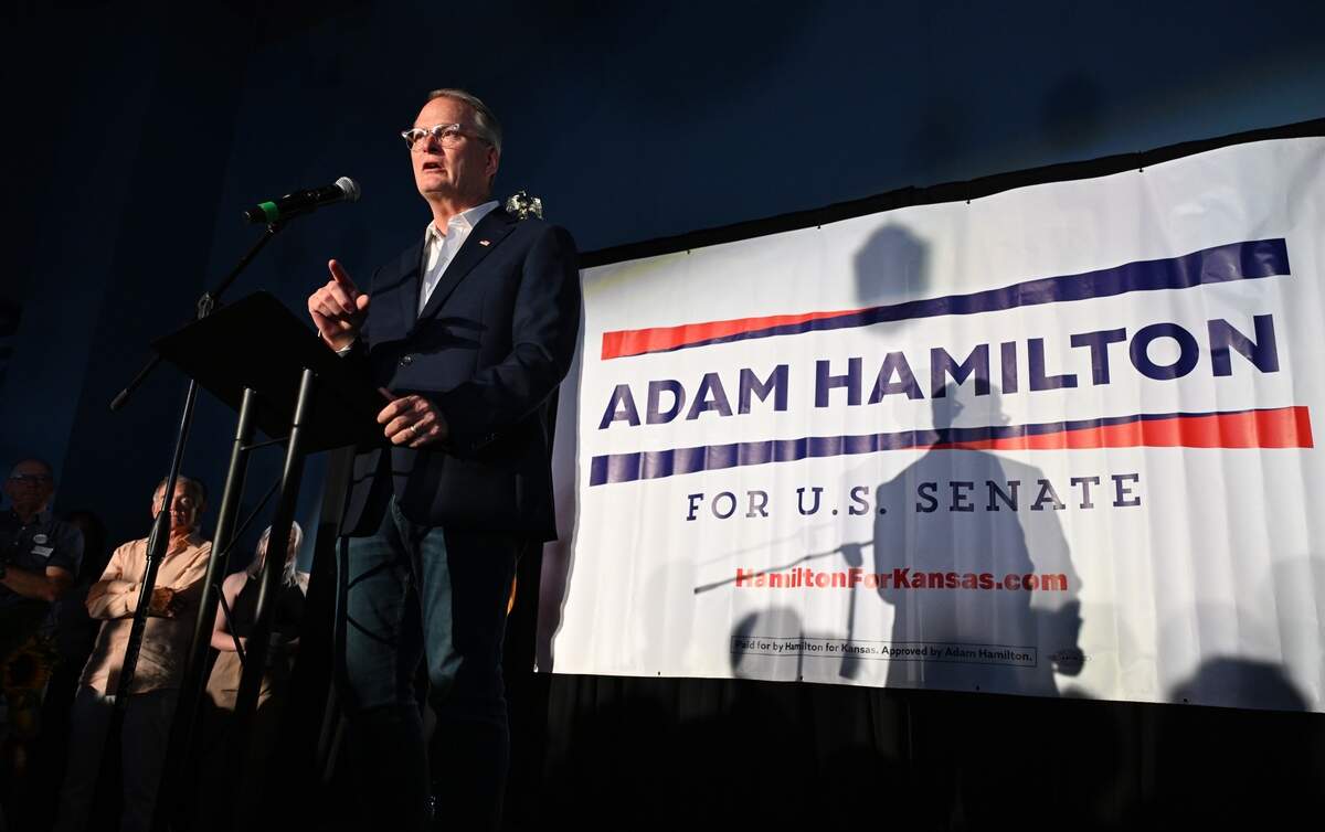 Rev. Adam Hamilton, senior pastor of the United Methodist Church of the Resurrection, speaks to a crowd of supporters at his victory party in Lenexa on Aug. 4, 2026. Hamilton won the Democratic primary for U.S. Senate in Kansas and will challenge Rep. Roger Marshall in November.