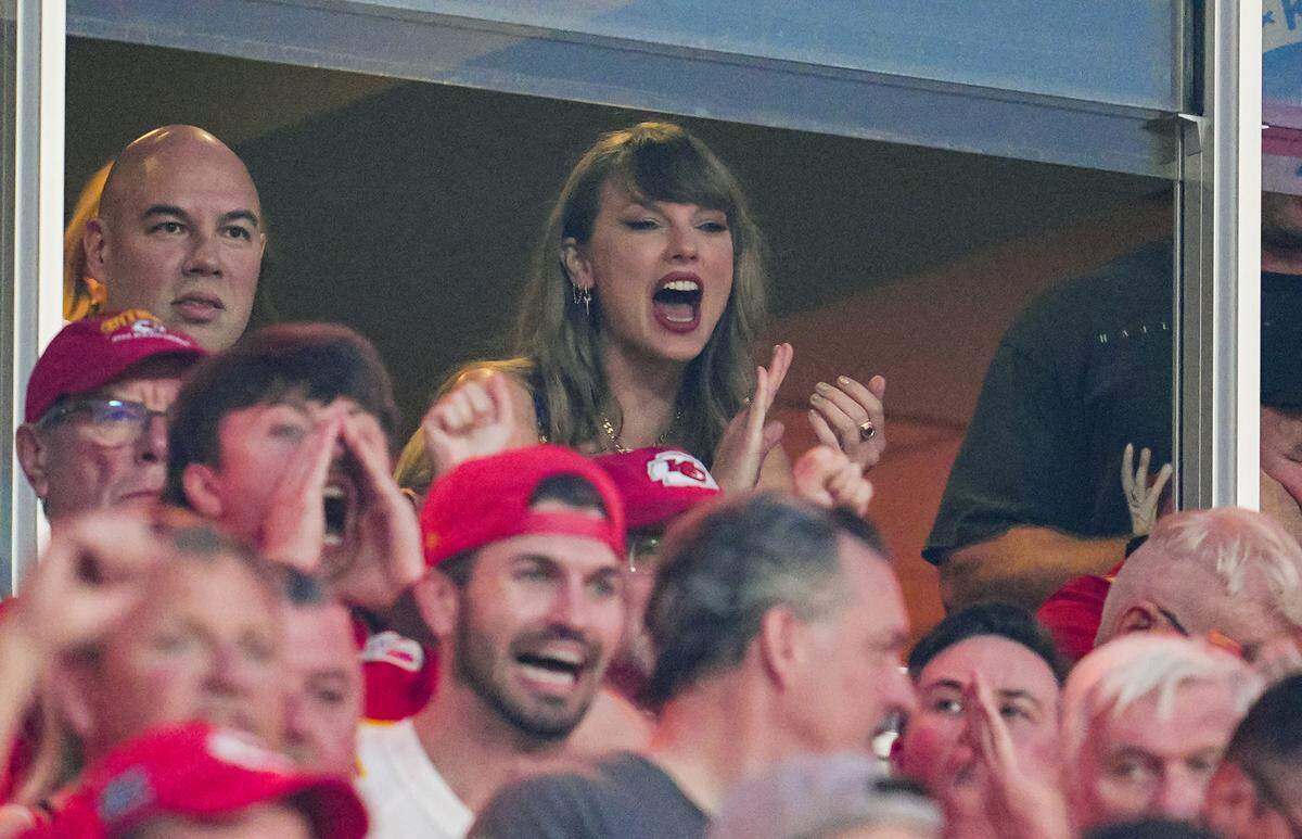 Eras Tour singer Taylor Swift watches the action during the first half of a game between the Baltimore Ravens and the Kansas City Chiefs at GEHA Field at Arrowhead Stadium.