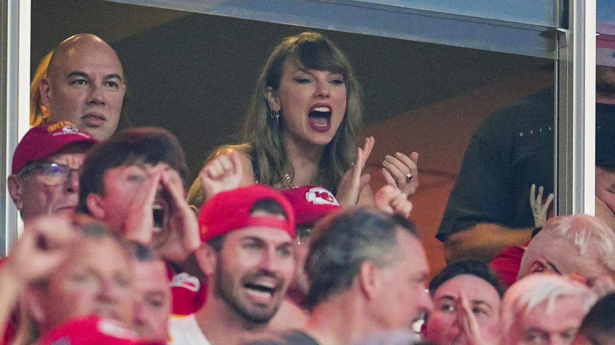 Eras Tour singer Taylor Swift watches the action during the first half of a game between the Baltimore Ravens and the Kansas City Chiefs at GEHA Field at Arrowhead Stadium.