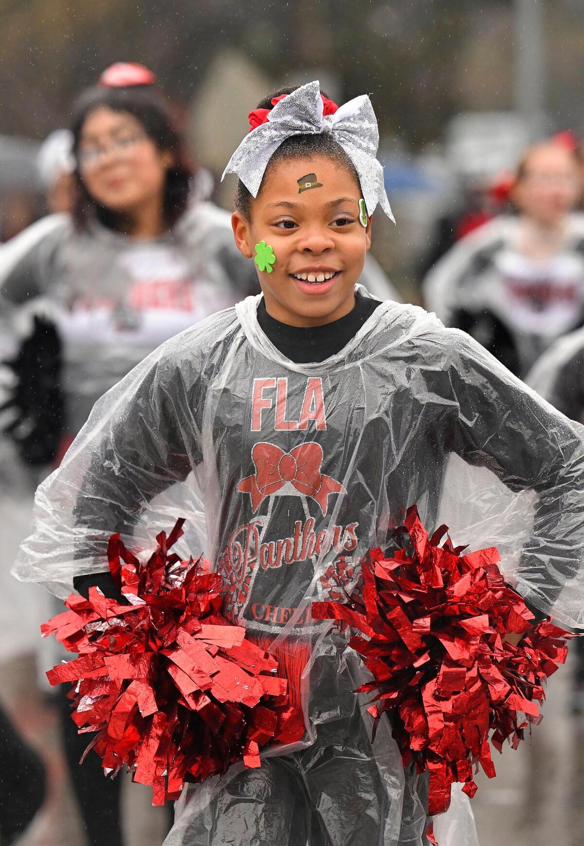 Extreme Team members from the Foreign Language Academy danced in the rain during the 2023 Brookside St. Patrick’s Day Warm-Up Parade on Saturday March 11, 2023 in Kansas City.