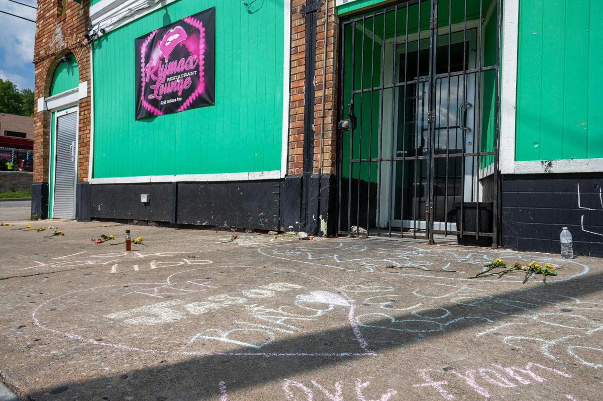 Messages written in chalk are seen on the sidewalk outside Klymax Lounge on Monday, May 22, 2023, in Kansas City. Three people were killed and two were injured in a shooting Sunday at the nightclub.