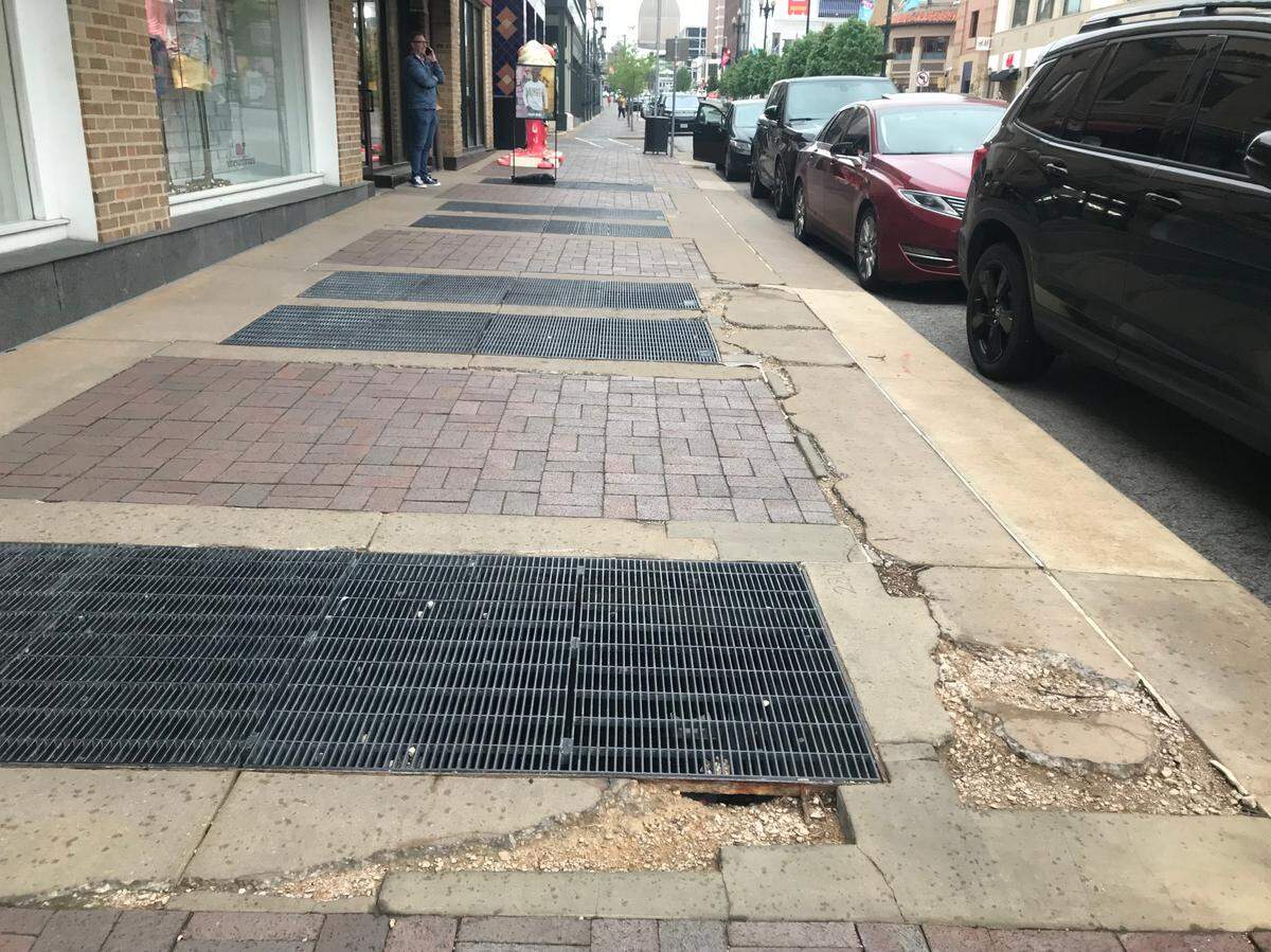 A crumbling sidewalk at the high traffic corner of 47th Street and Broadway on the Plaza.